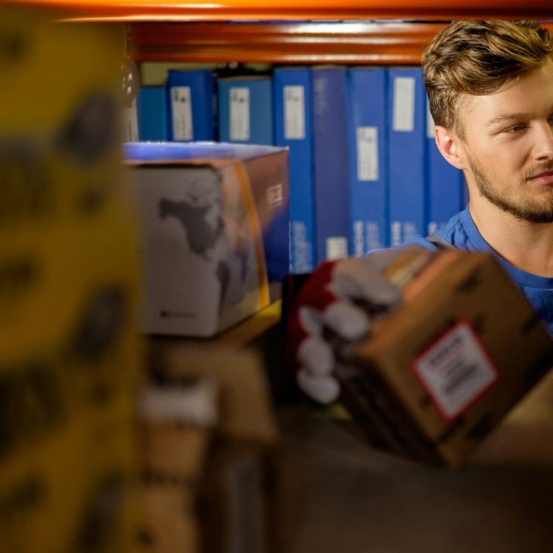 Worker on a automotive spare parts warehouse